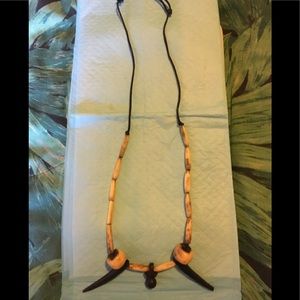 Bone tooth necklace with brown and tan beads